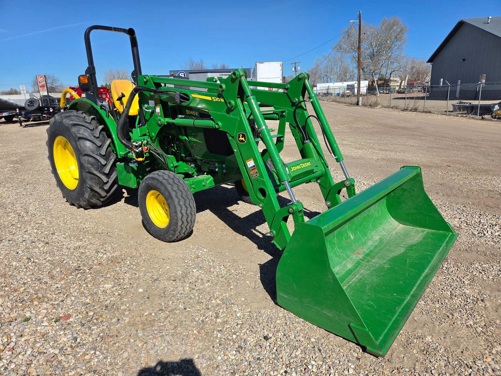 2023 John Deere 5045E Tractor with John Deere 520 Loader, 250 hrs, 3pt, 540 pto, mower, post hole auger, pallet forks, bale spear, bale unroller, quick tach bucket - Full size